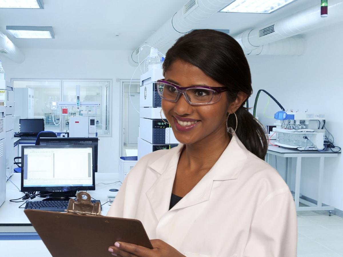 Lab worker in a lab wearing custom safety glasses.
