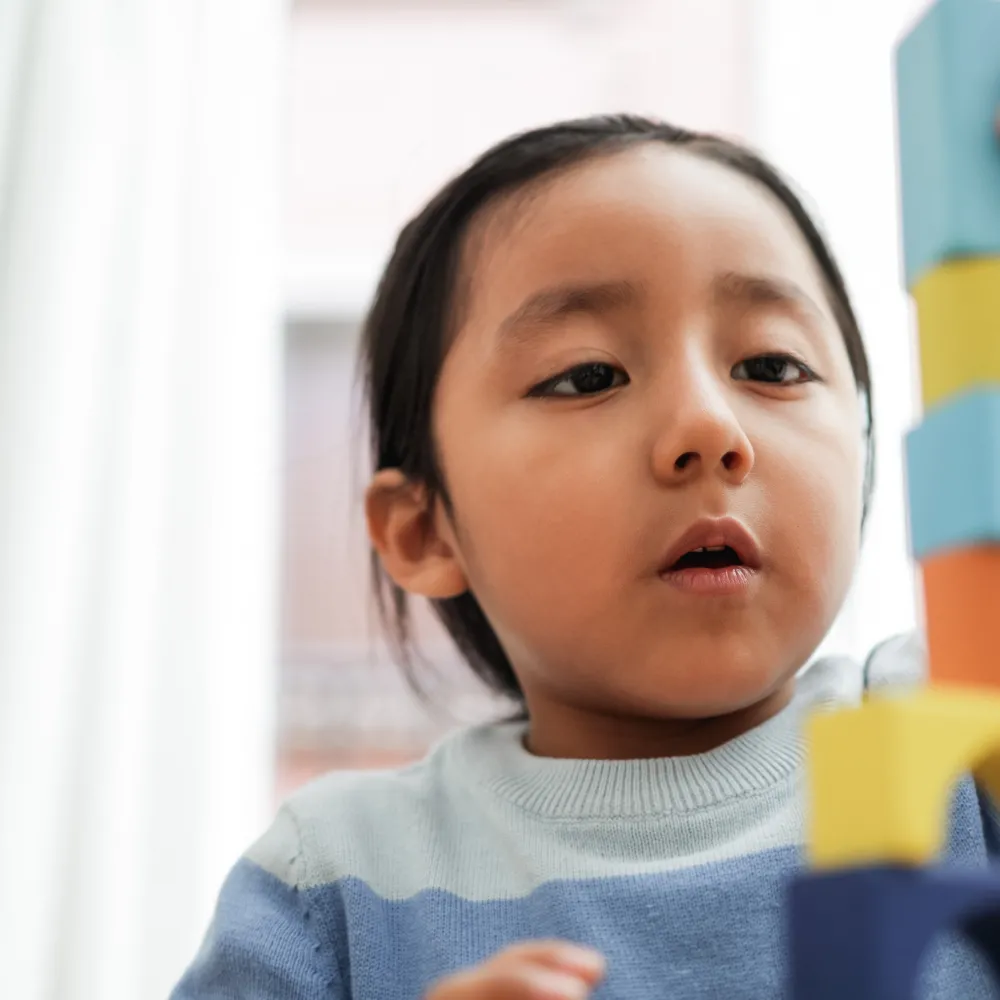 Child with building blocks.